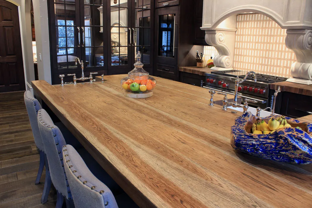A kitchen island with a distressed hickory countertop