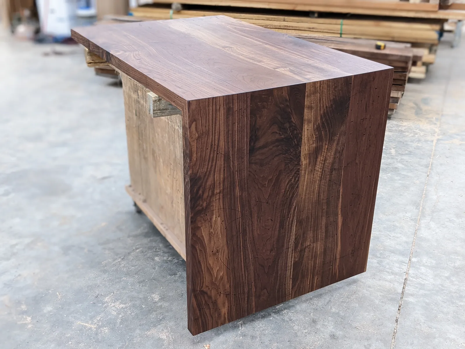 Distressed walnut countertop with waterfall end