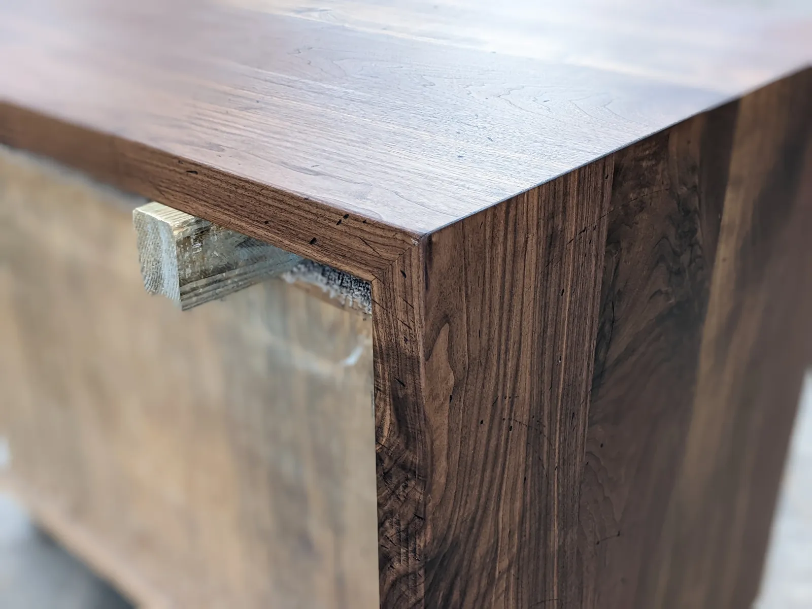 Distressed walnut countertop with waterfall end