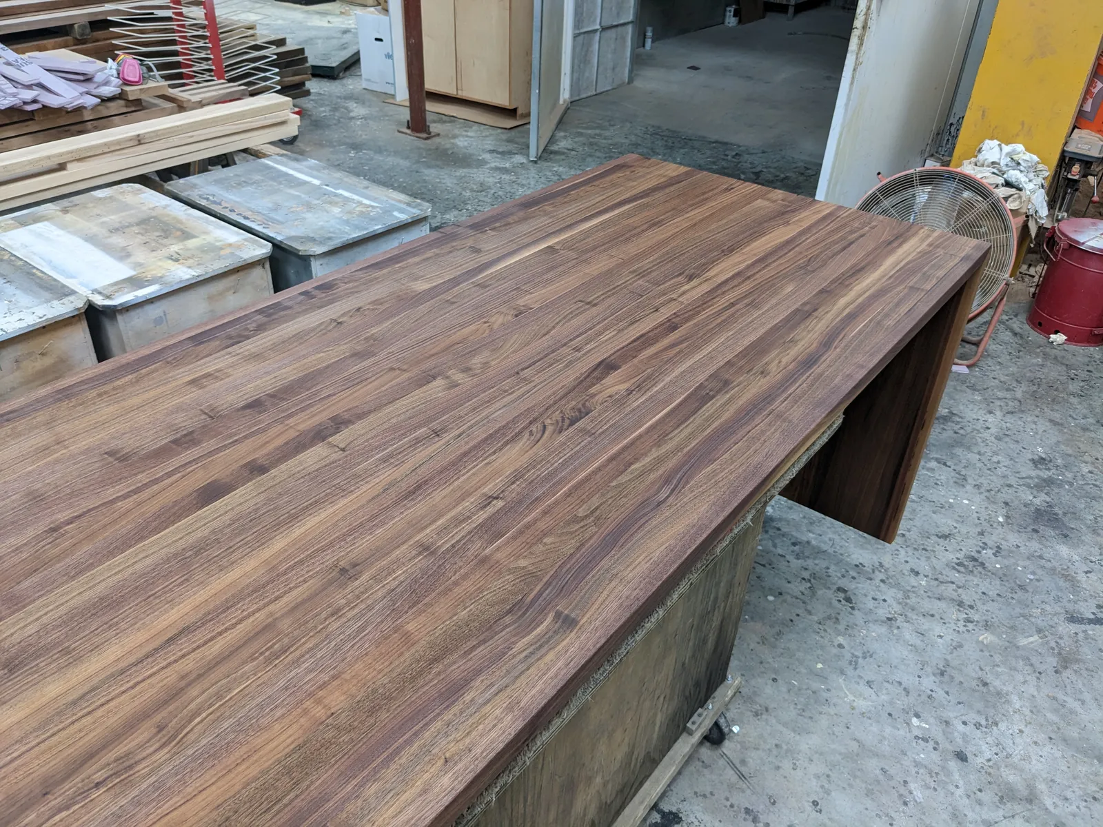 Walnut butcher block kitchen island with waterfall legs
