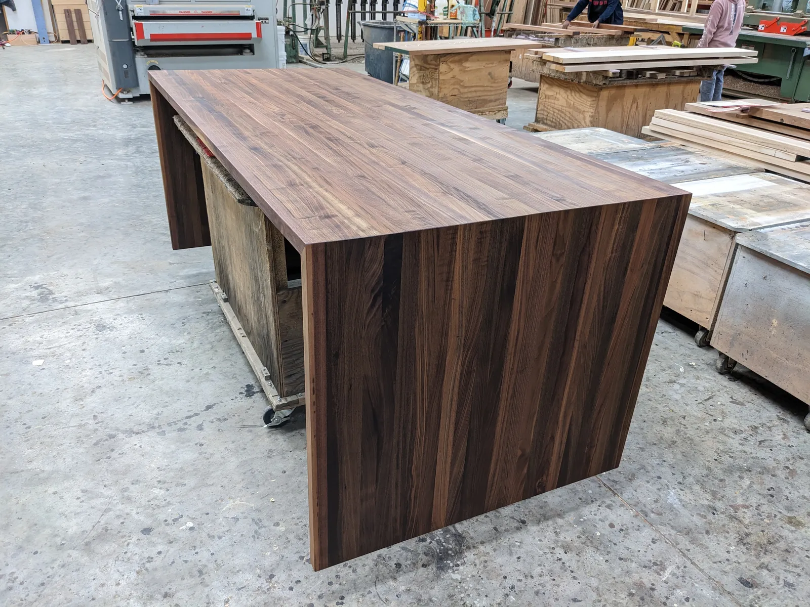 Walnut butcher block kitchen island with waterfall legs