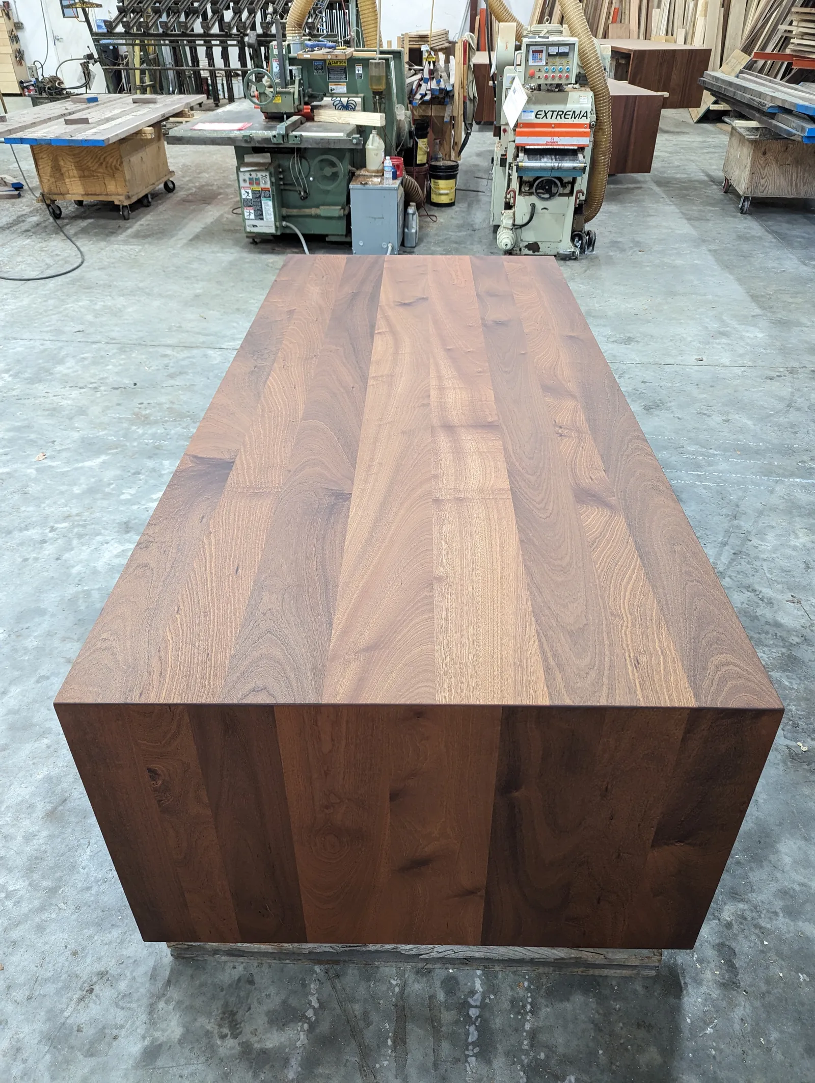 Custom sapele wood table with waterfall legs