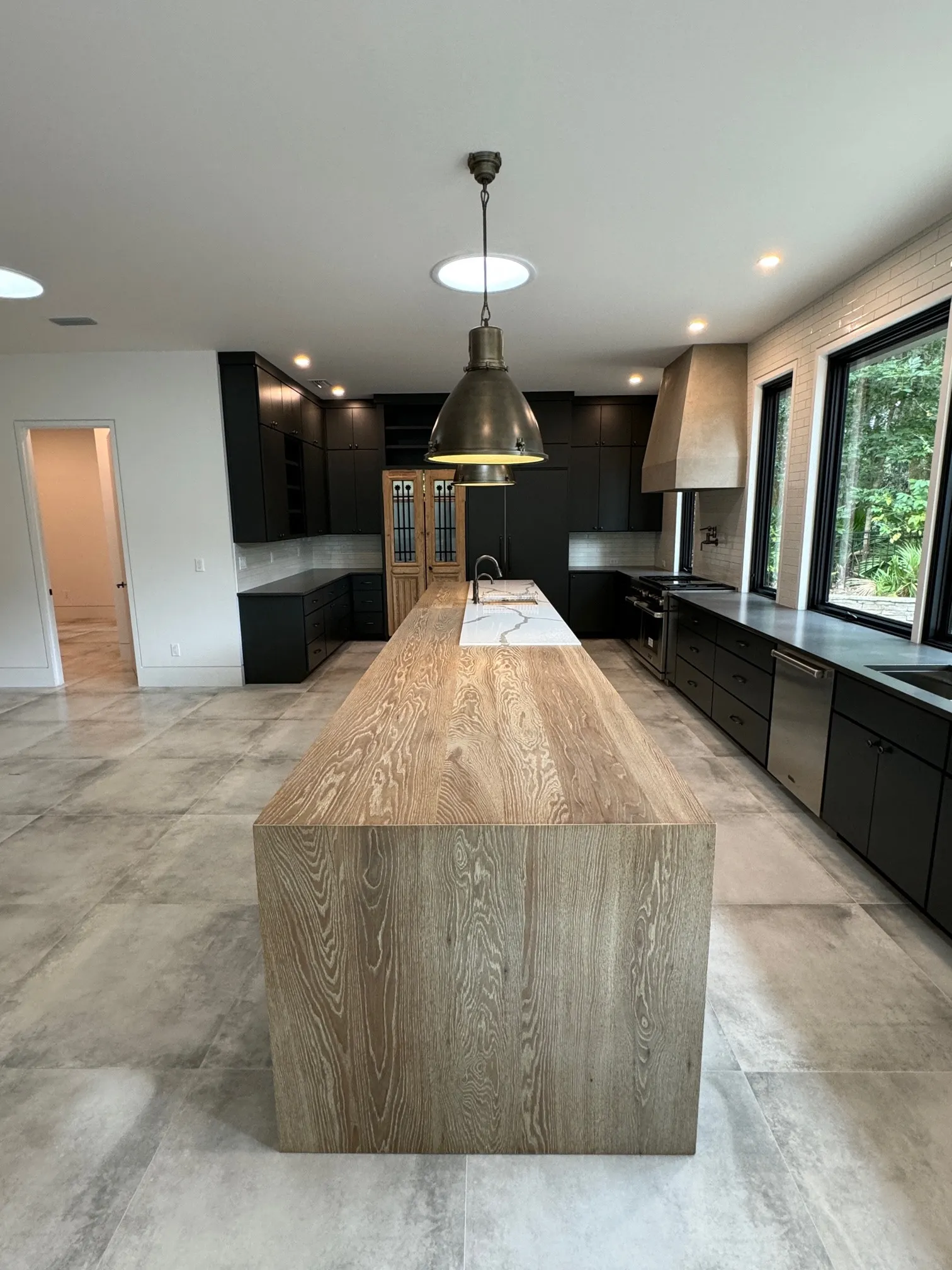 Our Charu finish on plank style white oak kitchen island countertop