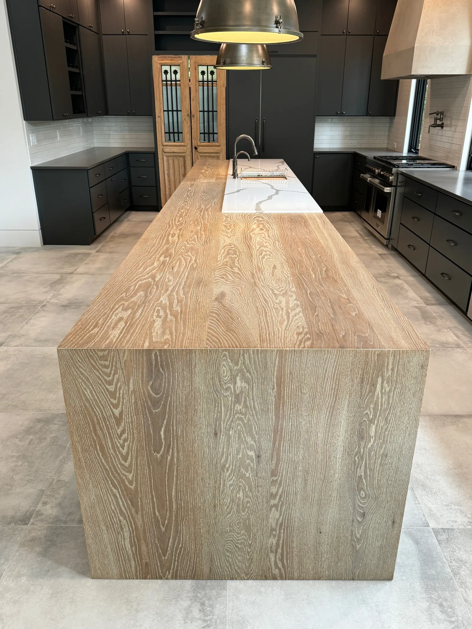 Our Charu finish on plank style white oak kitchen island countertop
