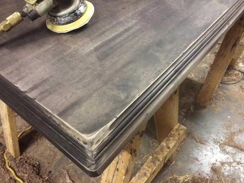 Sanding will remove the color on the flat surface and leave accents in the marks you've created.