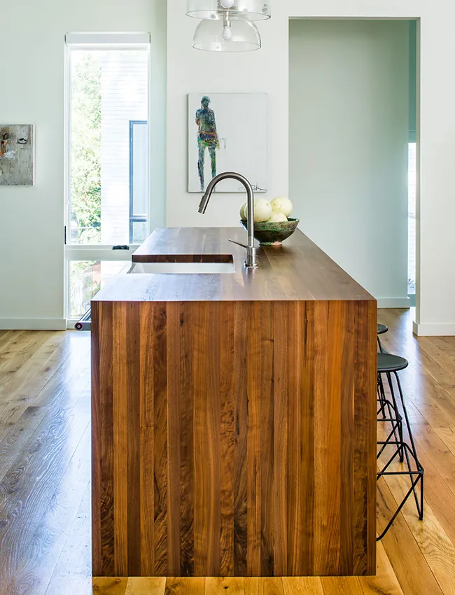 Walnut kitchen island in a modern kitchen design